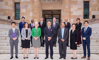 Participants in the signing ceremony on the steps of UQ's Forgan Smith building